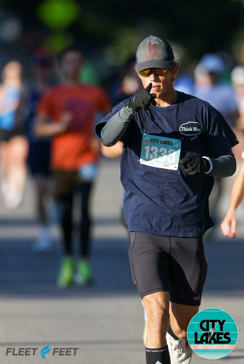 Anthony Kozaritz, AJKozFit coach, mid-race at the City Lakes Half Marathon