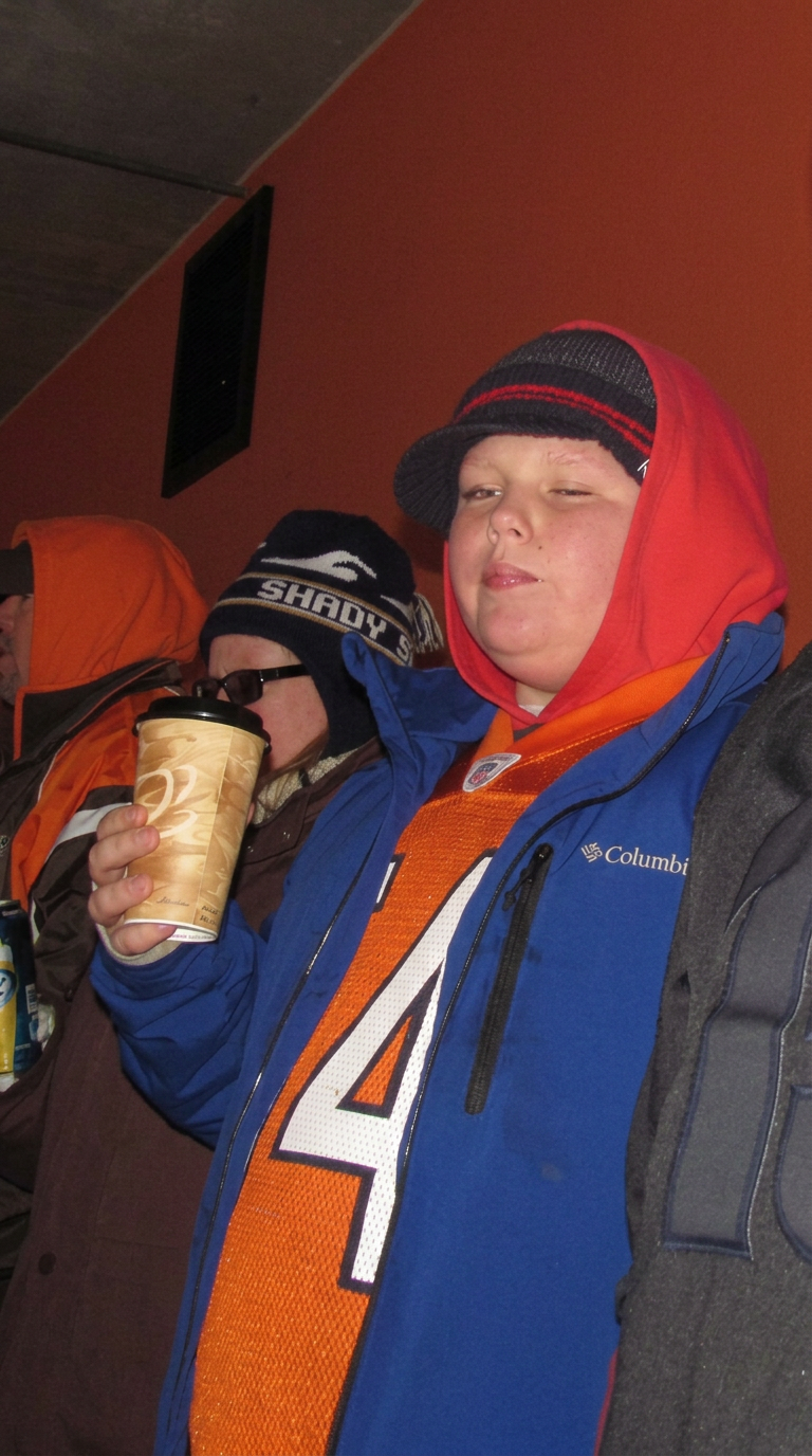 Anthony as a young child, overweight, at a Browns game